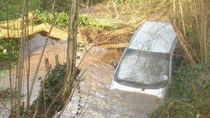 A driver had to be rescued from a car which was swept down a ford in Chew Stoke which was swollen by heavy rain