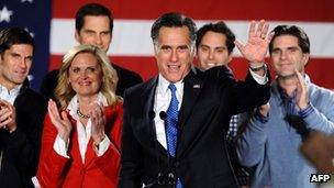 Republican presidential candidate Mitt Romney with his family behind him during his caucus night rally in Des Moines, Iowa, on Tuesday