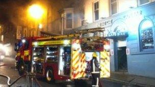 Firefighters outside Fat Cats bar on Bridge Street