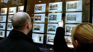 Looking in an estate agent's window