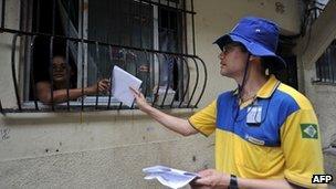 A postman delivers a letter at Rocinha shantytown in Rio de Janeiro, Brazil.