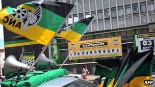 A car decked out with ANC flags drives by in Bloemfontein on January 5, 2012 to celebrate the 100th anniversary of South Africa"s ruling African National Congress (ANC) party