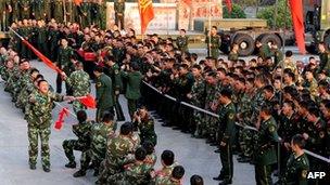 Soldiers of China's People's Liberation Army undergoing a tug-of-war at a military base in Hefei in December 2011