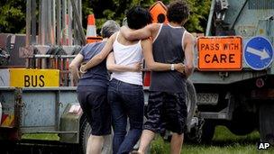 Three people bereaved by Saturday's hot air balloon crash in Carterton, north of Wellington, New Zealand, visit the crash site