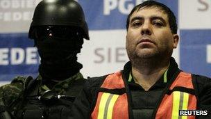 Suspect Felipe Cabrera Sarabia (right) is presented to the media in Mexico City in this 26 December 2011 file photo.