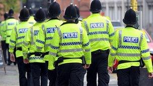 Police officers in high-visibility coats