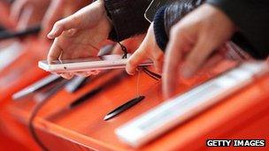 Ereaders being looked at at the Frankfurt Books Fair