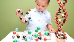 Boy building molecular structures