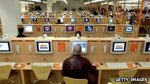 Users in an internet cafe in Times Square, New York