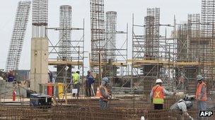 Workers at the ongoing construction of the Acu support belonging to the EBX Group of Brazilian billionaire Eike Batista,north of Rio de Janeiro