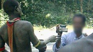 A tourist films Jarawa on the Andaman Trunk Road (Photo courtesy: Survival International)