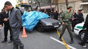 Iranian security forces at the scene of Mostafa Ahmadi-Roshan's killing