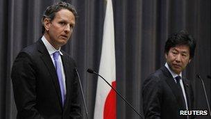 US Treasury Secretary Timothy Geithner, left, and his Japanese counterpart Jun Azumi in a joint press conference in Tokyo, Thursday, Jan. 12, 2012