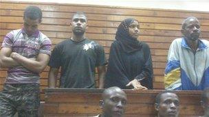 The four defendants standing in court in Mombasa, Kenya, 12 January 2012