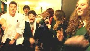 The pupils sing and dance throughout the school