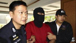 Thai police lead a detained a suspect with alleged links to Hezbollah