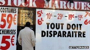 Paris shop advertises price cuts - file pic