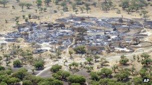 In this photo taken Saturday, 7 January, 2012 and released by the United Nations Mission in South Sudan (Unmiss), the burned village of Fertait is seen from the air, in Jonglei State, eastern South Sudan.