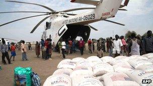 In this photo of Thursday, 12 January, 2012 relief food of the World Food Program is offloaded in Pibor, South Sudan.