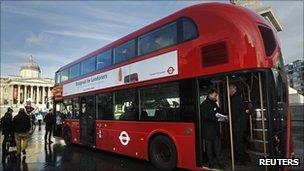 People look at the new-style London bus after its launch at Trafalgar Square in London, 26 December 2012