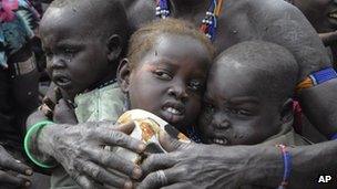Victims of ethnic violence in Jonglei, South Sudan, wait in Pibor to receive emergency food rations, 12 January 2012
