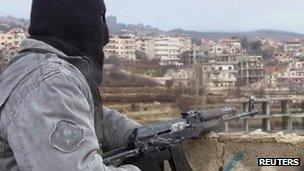 Purported photo of member of the Free Syrian Army on guard in the town of Zabadani (16 January 2012)