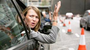 Frustrated woman in car, file pic