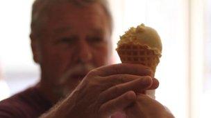 A man being served an ice cream