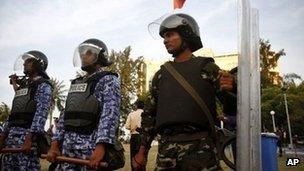 Maldives Military and Maldives police force guard the security force building in Male, Maldives, Tuesday, Jan. 17, 2012.