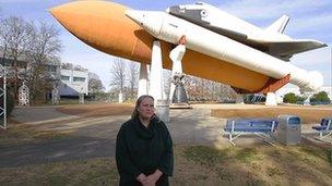 Karen Murphy in front of a shuttle replica in Huntsville, Alabama