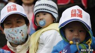 Baby wears a cap during a campaign of Taiwan President and Nationalist Party presidential candidate Ma Ying-jeou in Kaoshiung on 13 January 2012