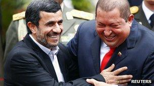 Iran's President Mahmoud Ahmadinejad is welcomed by Venezuela's President Hugo Chavez at Miraflores Palace in Caracas, January 2012