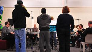 Prisoners, staff and musicians rehearsing Beyond This