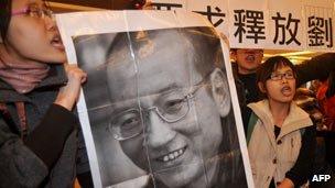 Demonstrators hold a portrait of China's detained Nobel Peace Prize winner Liu Xiaobo demanding his immediate release during a protest in Taipei, Taiwan, on 20 December 2010