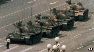 A Chinese man blocks a line of tanks heading east on Beijing's Changan Boulevard after Chinese forces crushed a pro democracy demonstration in Tiananmen Square on 5 June 1989