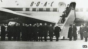 Queen Elizabeth II returns to the UK following her accession to the throne