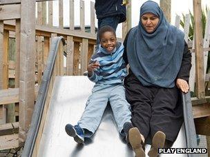 woman and child on slide