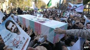 Iranians carry the coffin of nuclear scientist Mostafa Ahmadi-Roshan