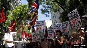 Argentine left-wing activists burn a Union flag outside the British embassy in Buenos Aires