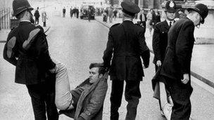 A young Peter Hain being dragged away by police at a protest