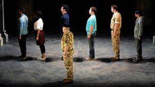 Actors on stage during rehearsal