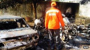 Burnt-out wreckage from bomb attacks in Kano, Nigeria, on 22 January 2012