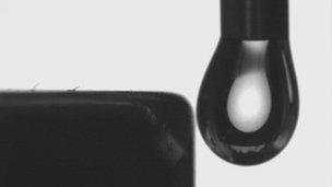 Drop of magnetic soap solution and a magnet