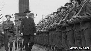 First Taoiseach of the Republic of Ireland Eamon de Valera inspects a guard of honour at O'Connell Street in Dublin