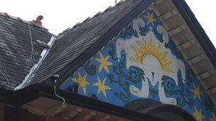 The seven stars mural on the building's gable