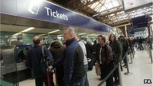 People queuing for train tickets at Victoria