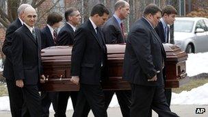 Pallbearers carry Joe Paterno's casket at Penn State campus 25 January 2012