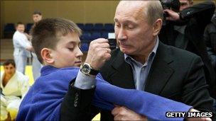 Vladimir Putin demonstartes Judo on a boy