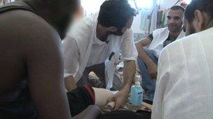 Medecins Sans Frontieres staff treating a man in Misrata