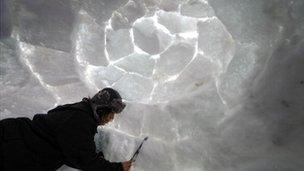 A man makes an Igloo